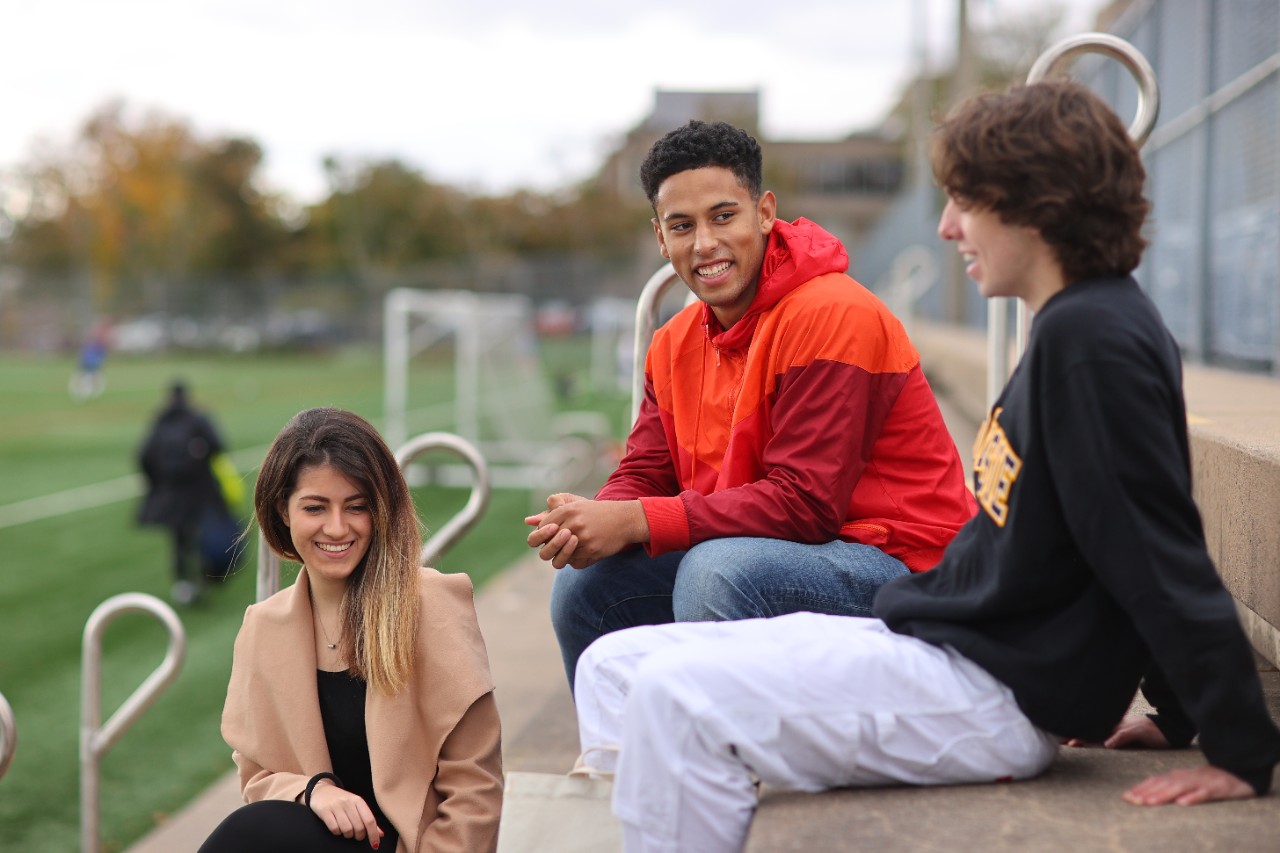 students on bleachers at Wickwire field