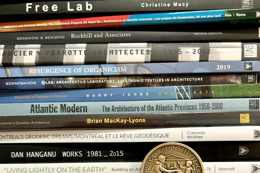An unevenly stacked pile of books that have been published by authors associated with Dalhousie's School of Architecture.