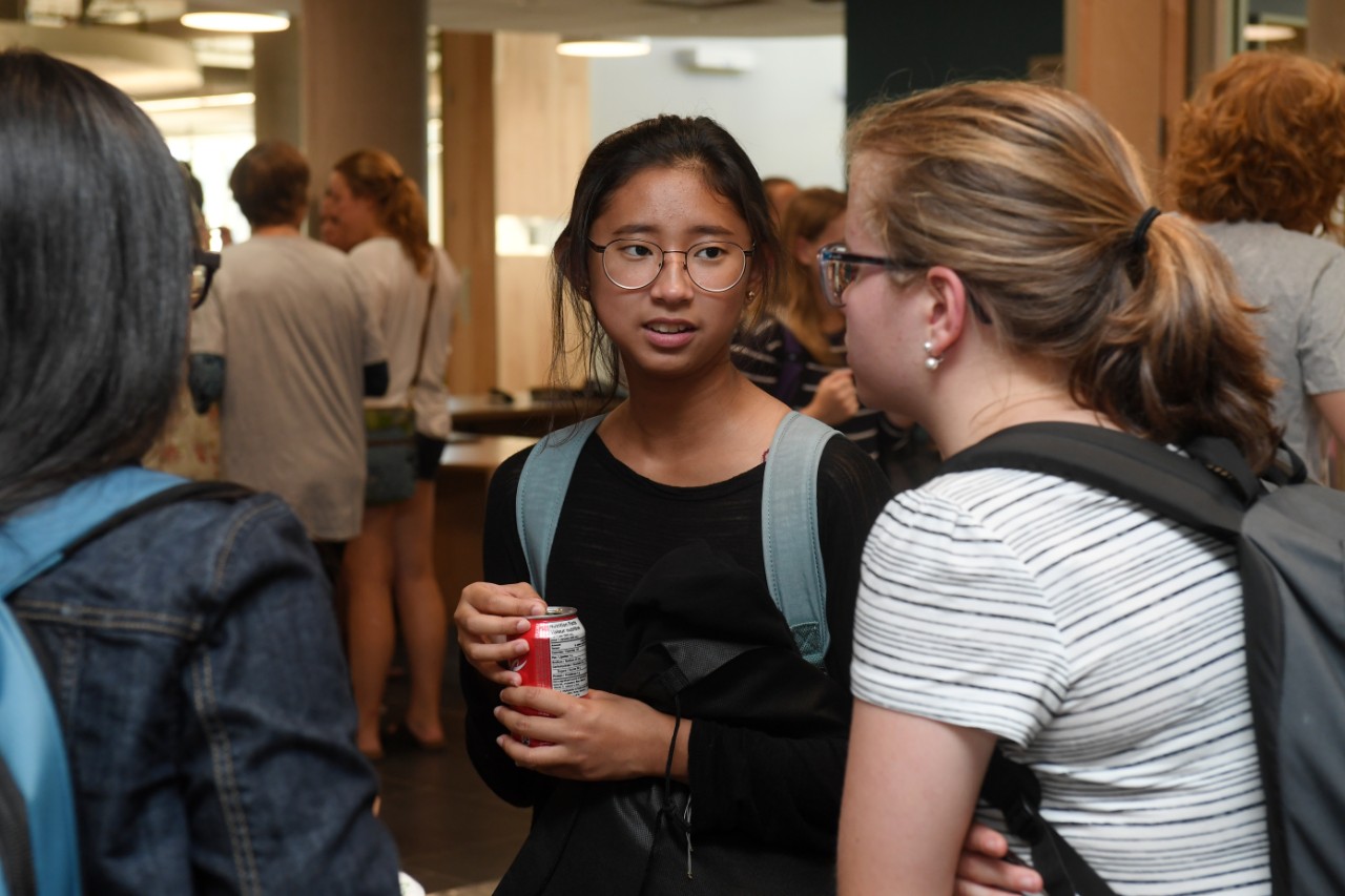 Students chat during a reception-style event