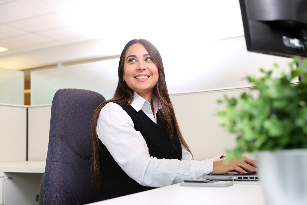 Employee working in an office cubicle.